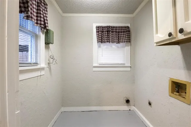 a bathroom with a window and a shower