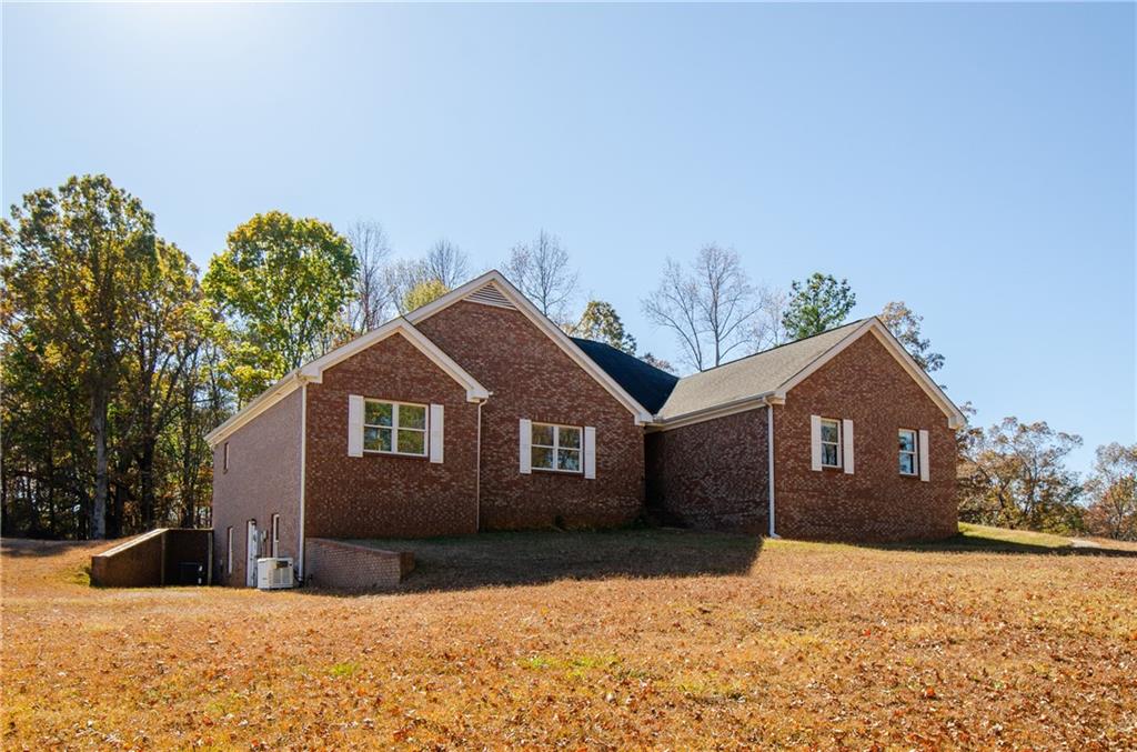 3950 Chattahoochee Road Cumming, GA 30041 - Photo 1 of 45 a front view of a house with a yard covered in snow