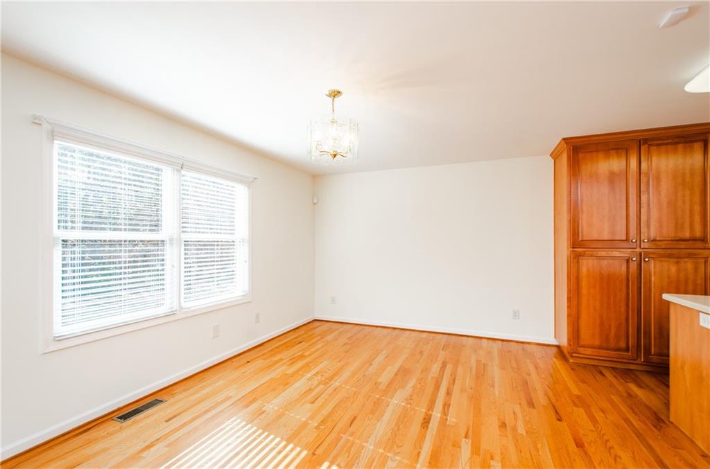 3950 Chattahoochee Road Cumming, GA 30041 - Photo 15 of 45 a view of empty room with wooden floor and fan