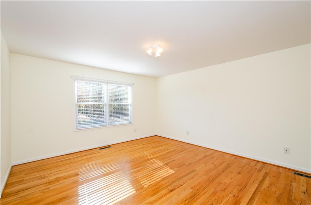 3950 Chattahoochee Road Cumming, GA 30041 - Photo 23 of 45 an empty room with wooden floor and windows