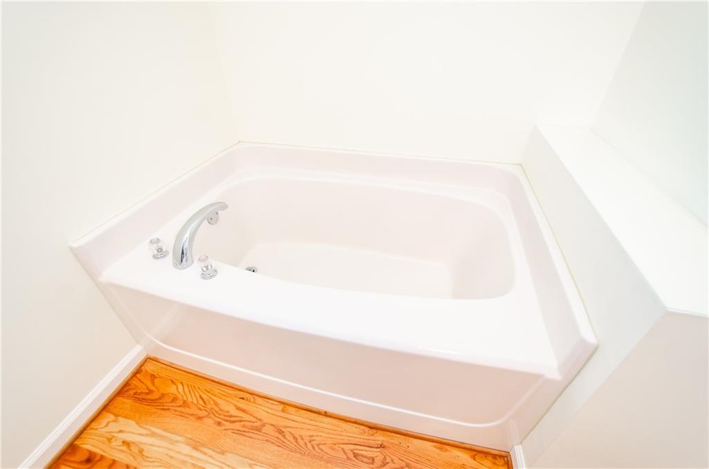 3950 Chattahoochee Road Cumming, GA 30041 - Photo 29 of 45 a bathroom with a tub
