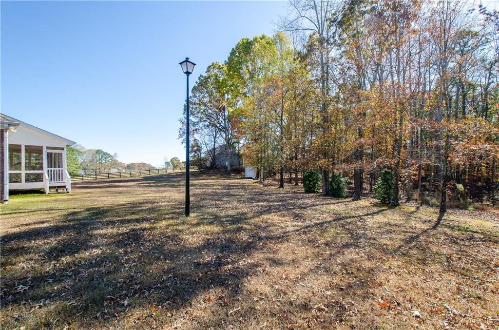 3950 Chattahoochee Road Cumming, GA 30041 - Photo 6 of 45 a view of a house with a yard