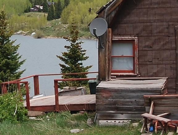 967 North Trout Lake Road Ophir, CO 81426 - Photo 5 of 7 a wooden bench sitting in front of a building