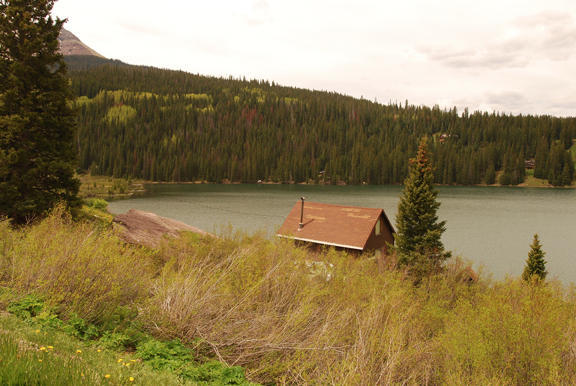 967 North Trout Lake Road Ophir, CO 81426 - Photo 6 of 7 a view of a water pond with mountain in the background