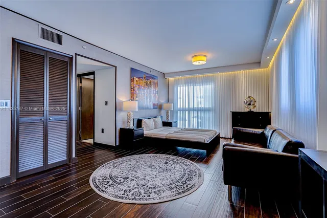 a living room with furniture and a rug