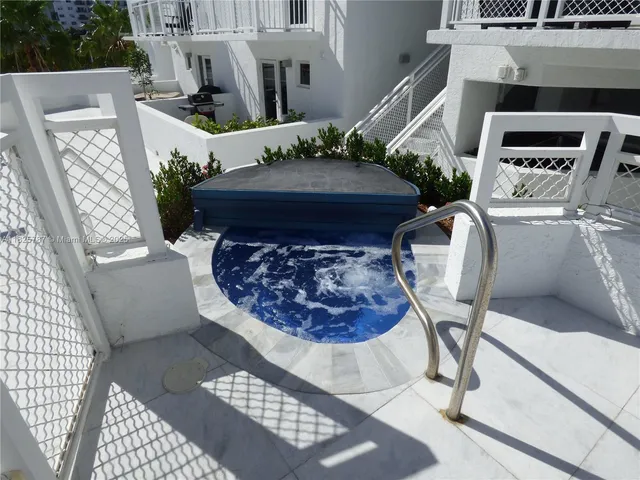 a view of swimming pool with seating space