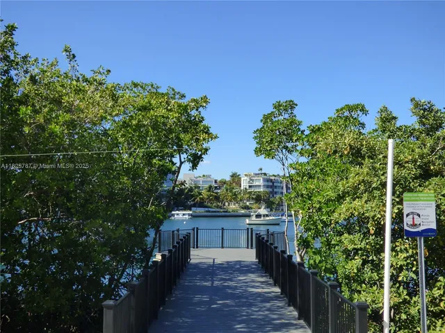 a view of a backyard with plants and a patio