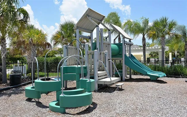 a view of lake with residential houses with outdoor space and trees