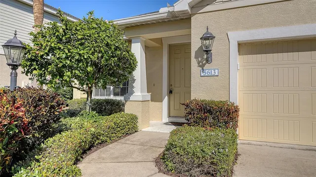 a living room with furniture a rug and a window