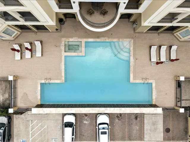 a view of a patio with a table and chairs