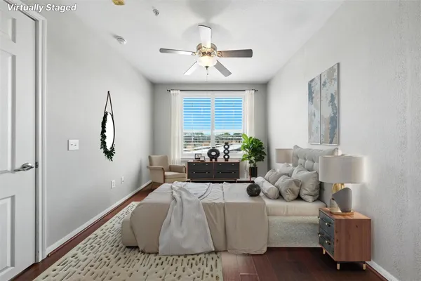 a living room with furniture rug and window