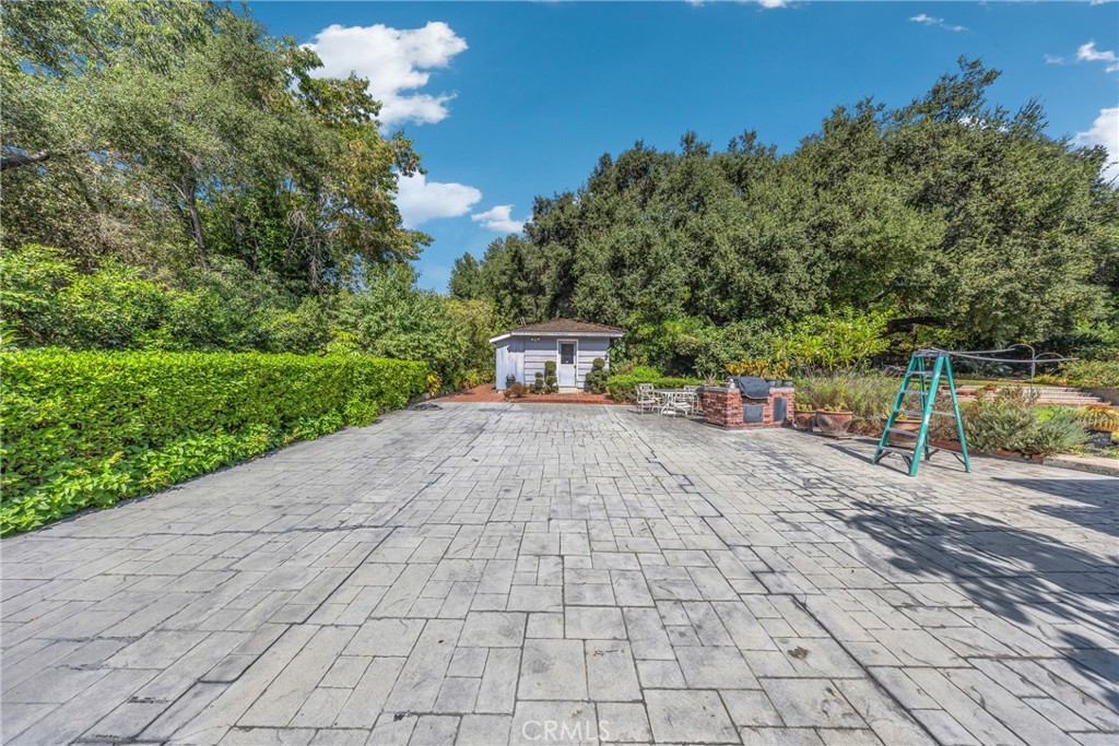 827 Hampton Road Arcadia, CA 91006 - Photo 18 of 37 a view of a white house with a yard and hanging chair