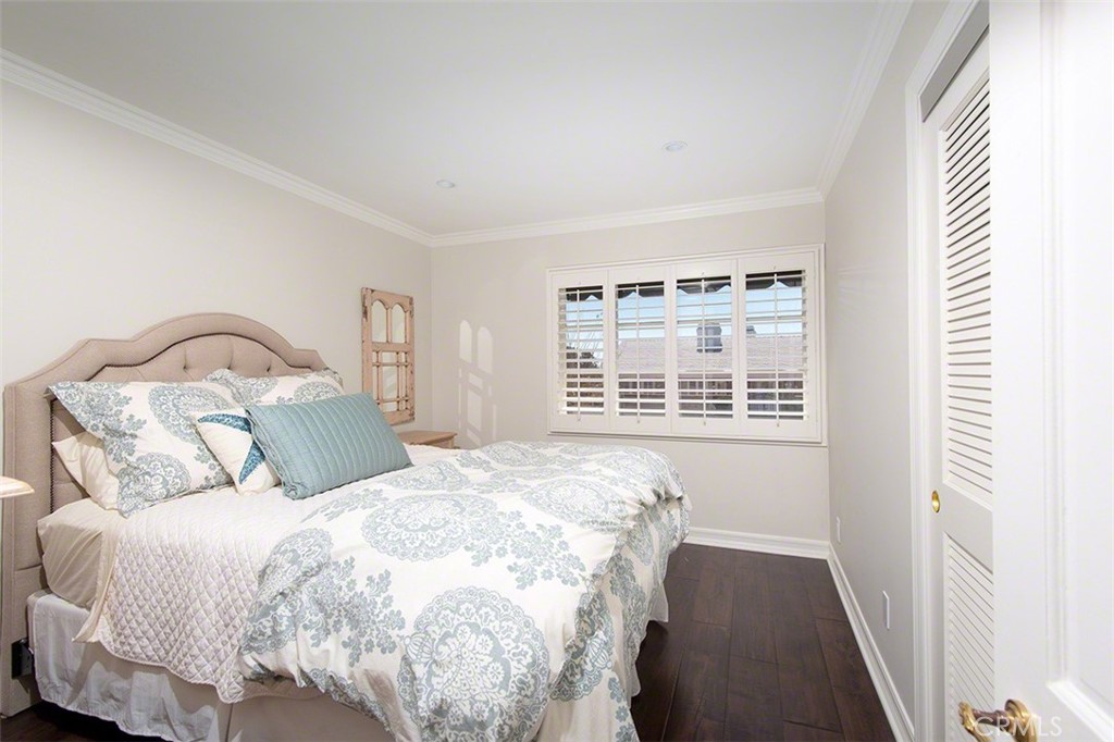 718 Emerald Bay Laguna Beach, CA 92651 - Photo 13 of 20 a large bed sitting in a bedroom next to a window