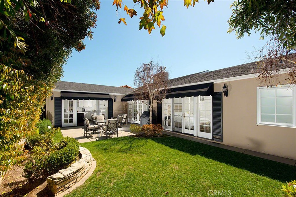 718 Emerald Bay Laguna Beach, CA 92651 - Photo 17 of 20 a view of a house with backyard porch and sitting area