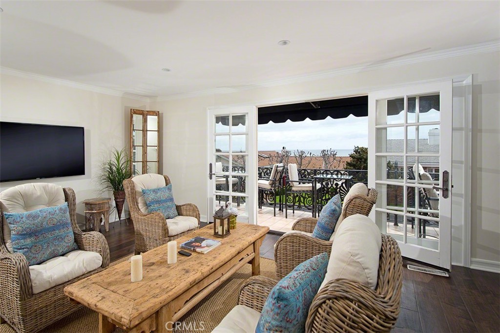 718 Emerald Bay Laguna Beach, CA 92651 - Photo 8 of 20 a living room with furniture and a flat screen tv