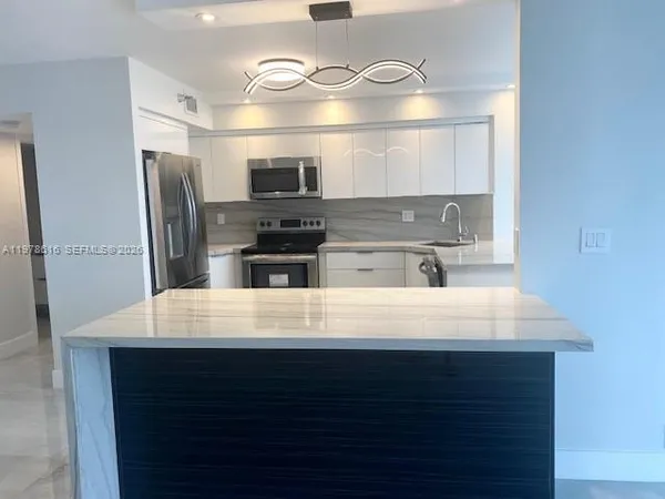 a bathroom with a granite countertop sink mirror and double