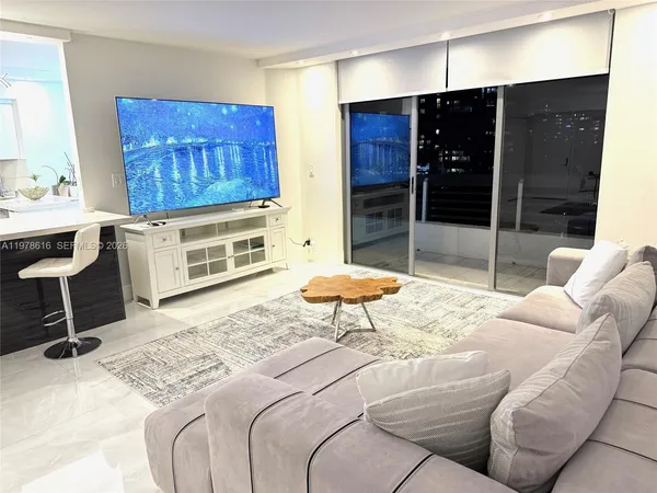a kitchen with stainless steel appliances a stove refrigerator sink and microwave
