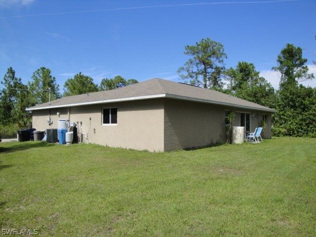 4502 East 21st Street Alva, FL 33920 - Photo 2 of 2 a house that has a tree in front of it
