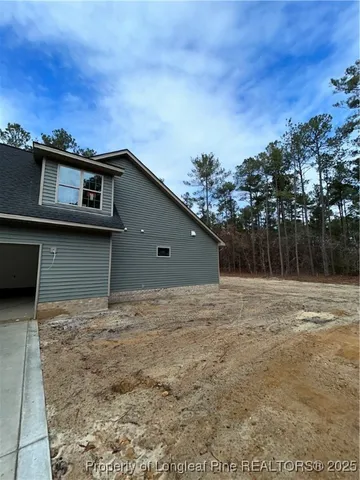 a house with trees in the background