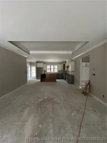 a view of empty room with a fireplace