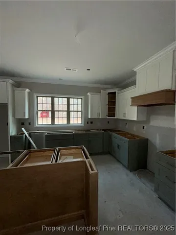 a room with furniture pool table and windows