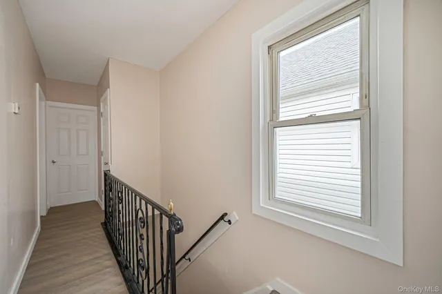 a view of a hallway with a window