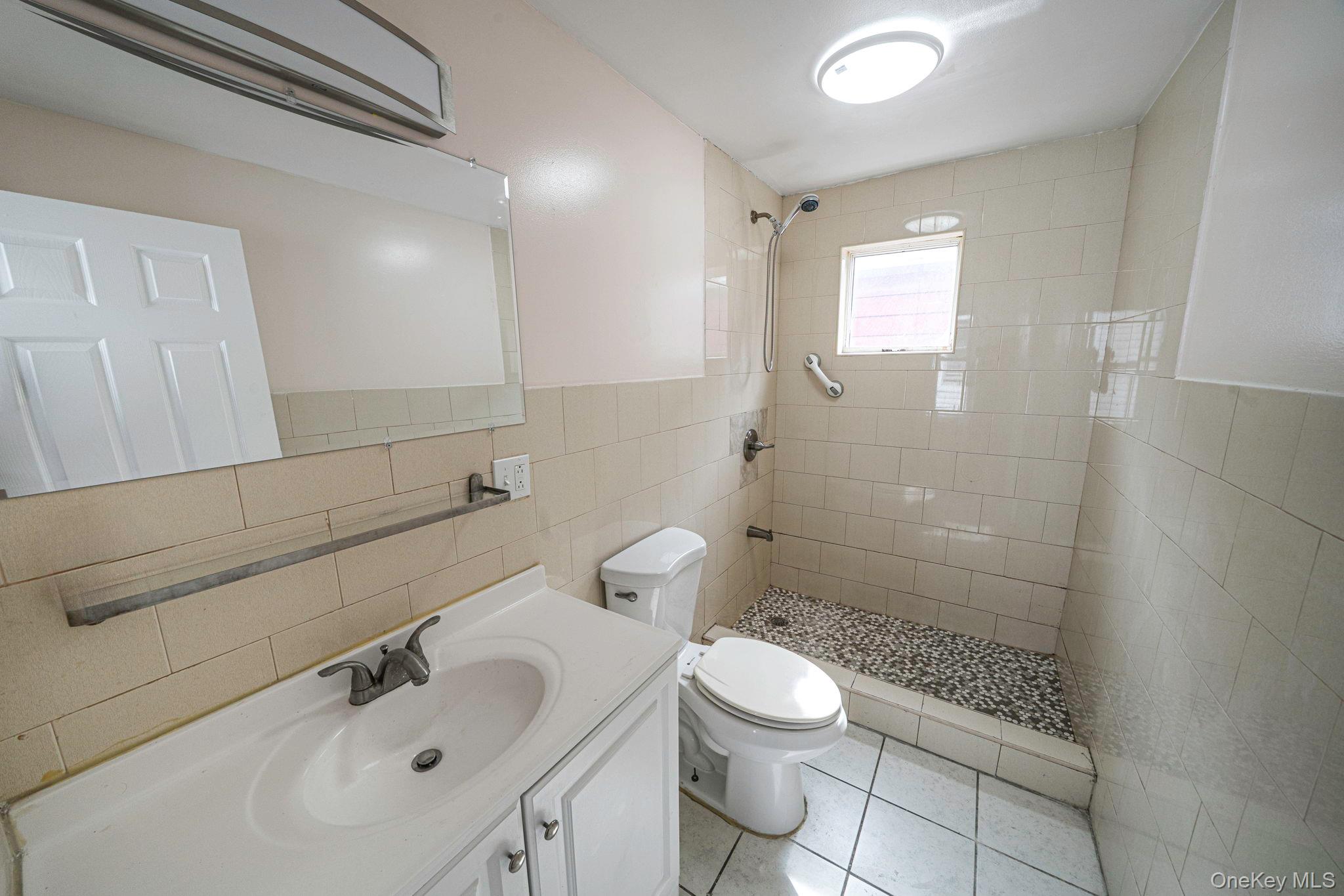 101-31 116th Street Queens, NY 11419 - Photo 9 of 19 a bathroom with a sink toilet and shower