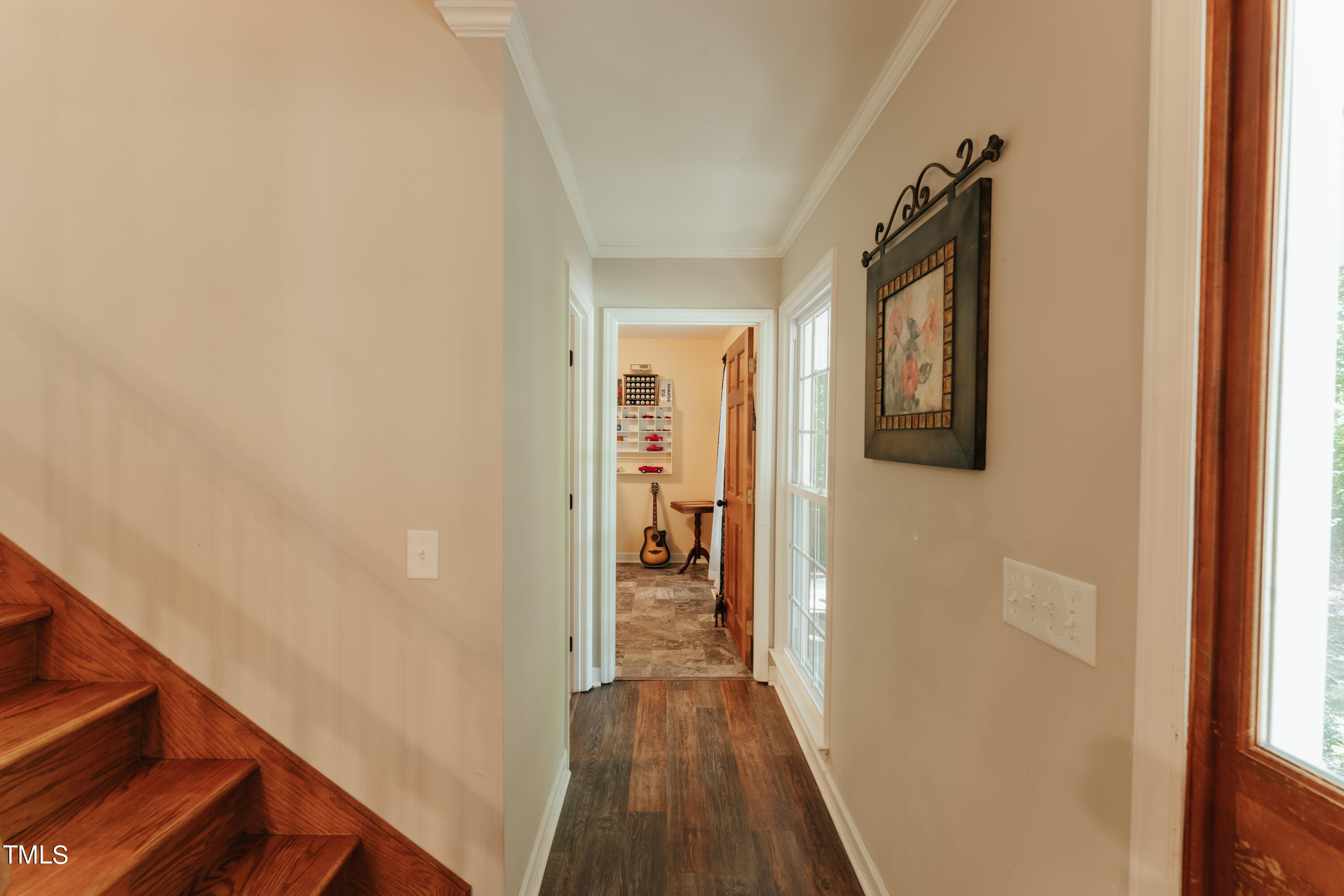 55 Sycamore Road Roxboro, NC 27574 - Photo 14 of 73 a view of a hallway with wooden floor and staircase