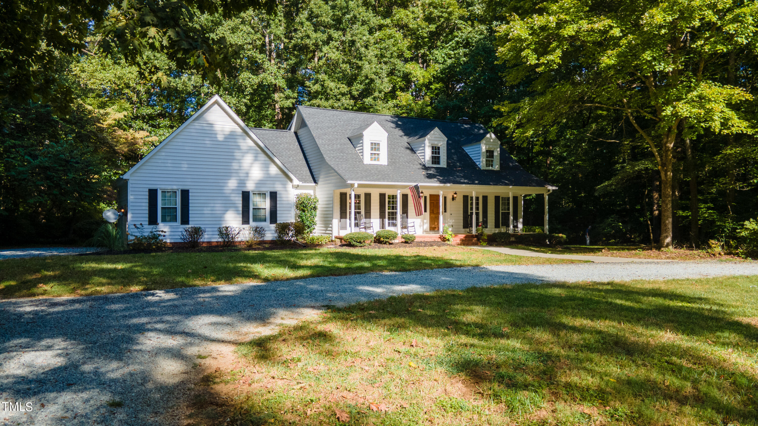 55 Sycamore Road Roxboro, NC 27574 - Photo 2 of 73 a front view of a house with a yard table and chairs
