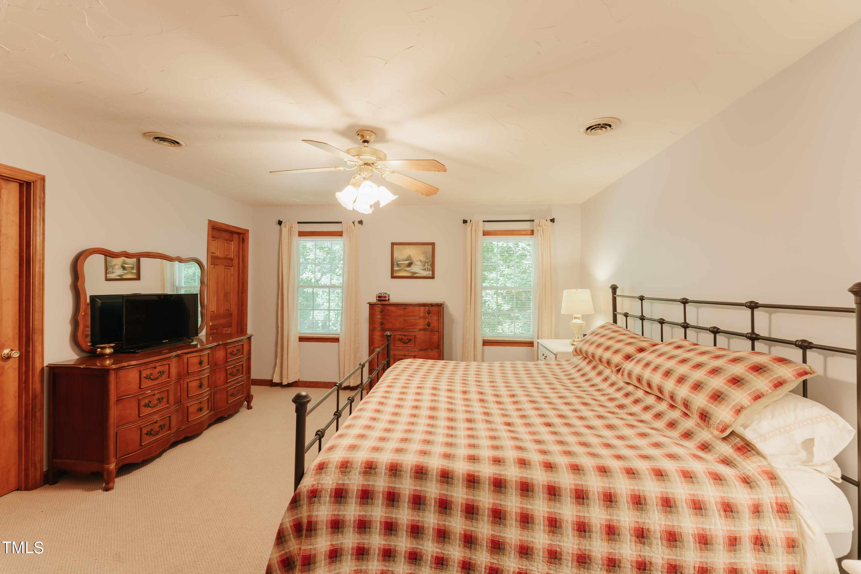 55 Sycamore Road Roxboro, NC 27574 - Photo 22 of 73 a bedroom with a bed and a flat screen tv