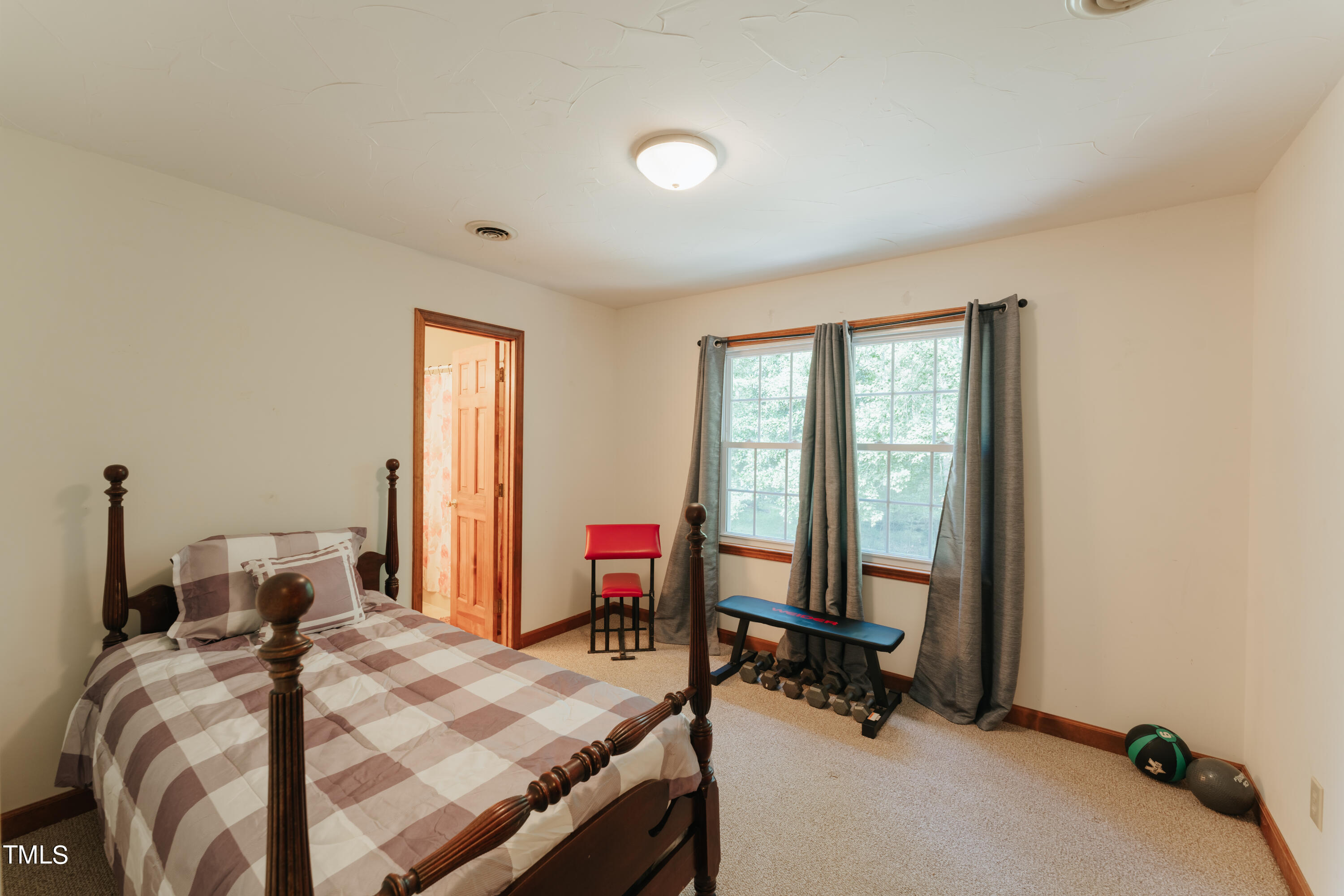 55 Sycamore Road Roxboro, NC 27574 - Photo 29 of 73 a bed room with a bed and a window