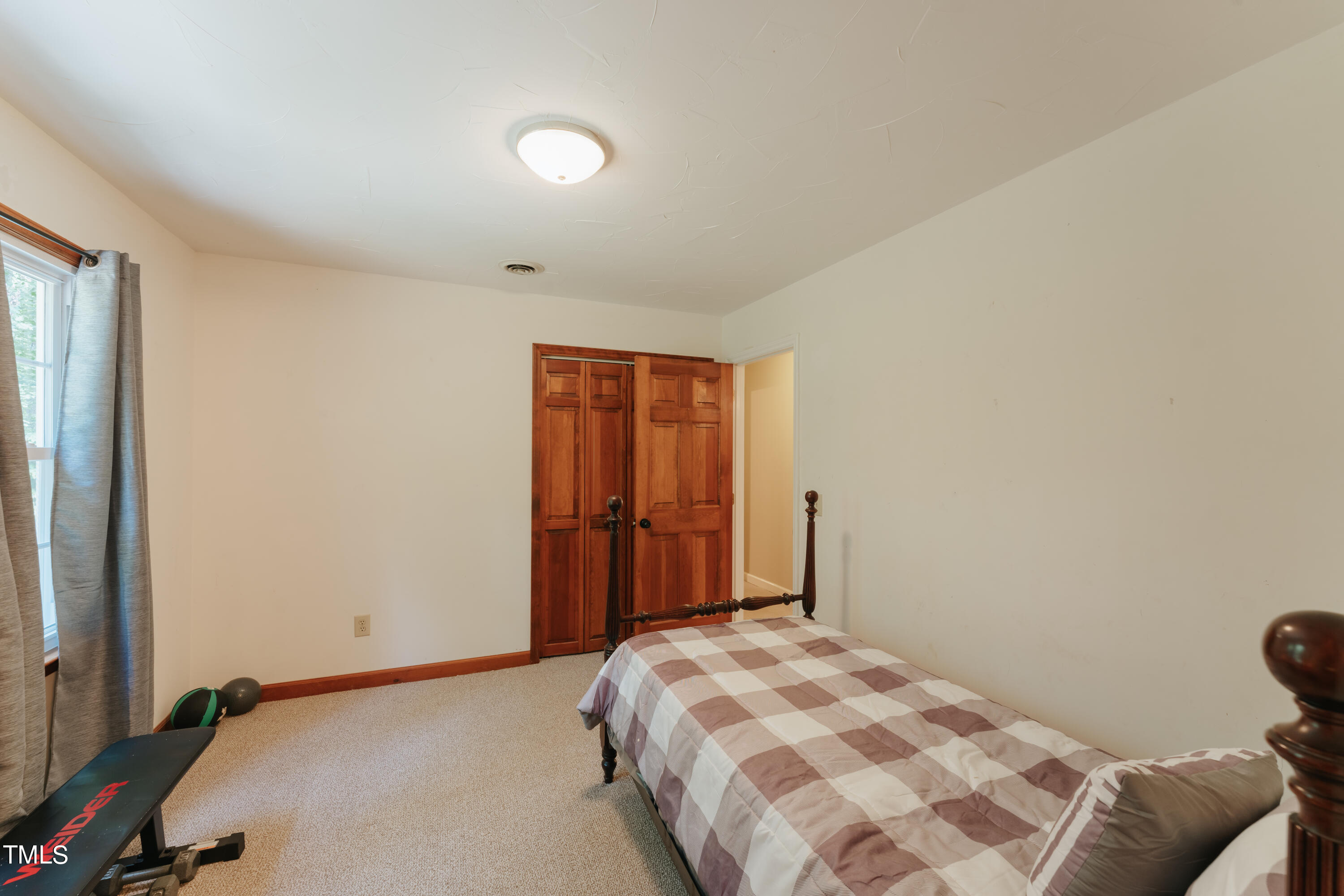 55 Sycamore Road Roxboro, NC 27574 - Photo 30 of 73 a bedroom with a bed and a window