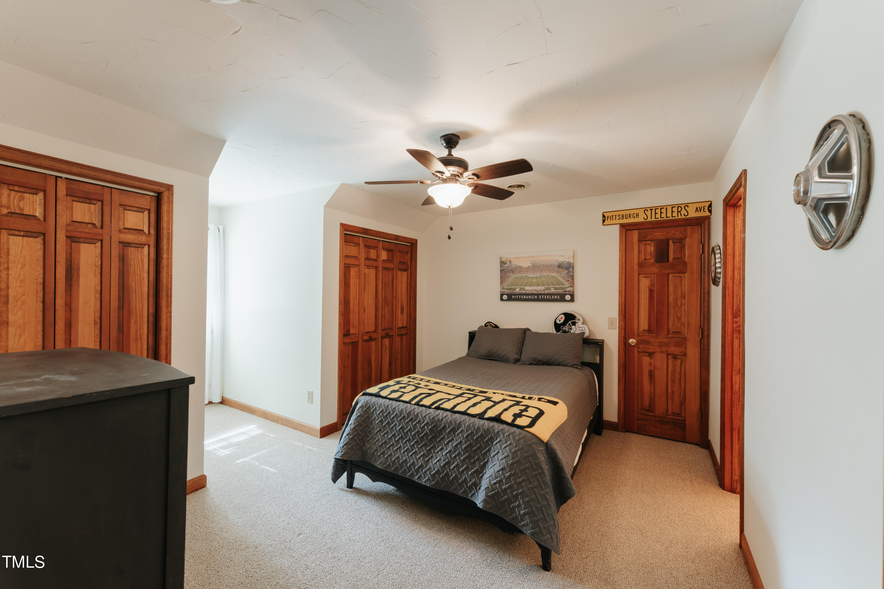55 Sycamore Road Roxboro, NC 27574 - Photo 35 of 73 a bedroom with a bed and a chandelier