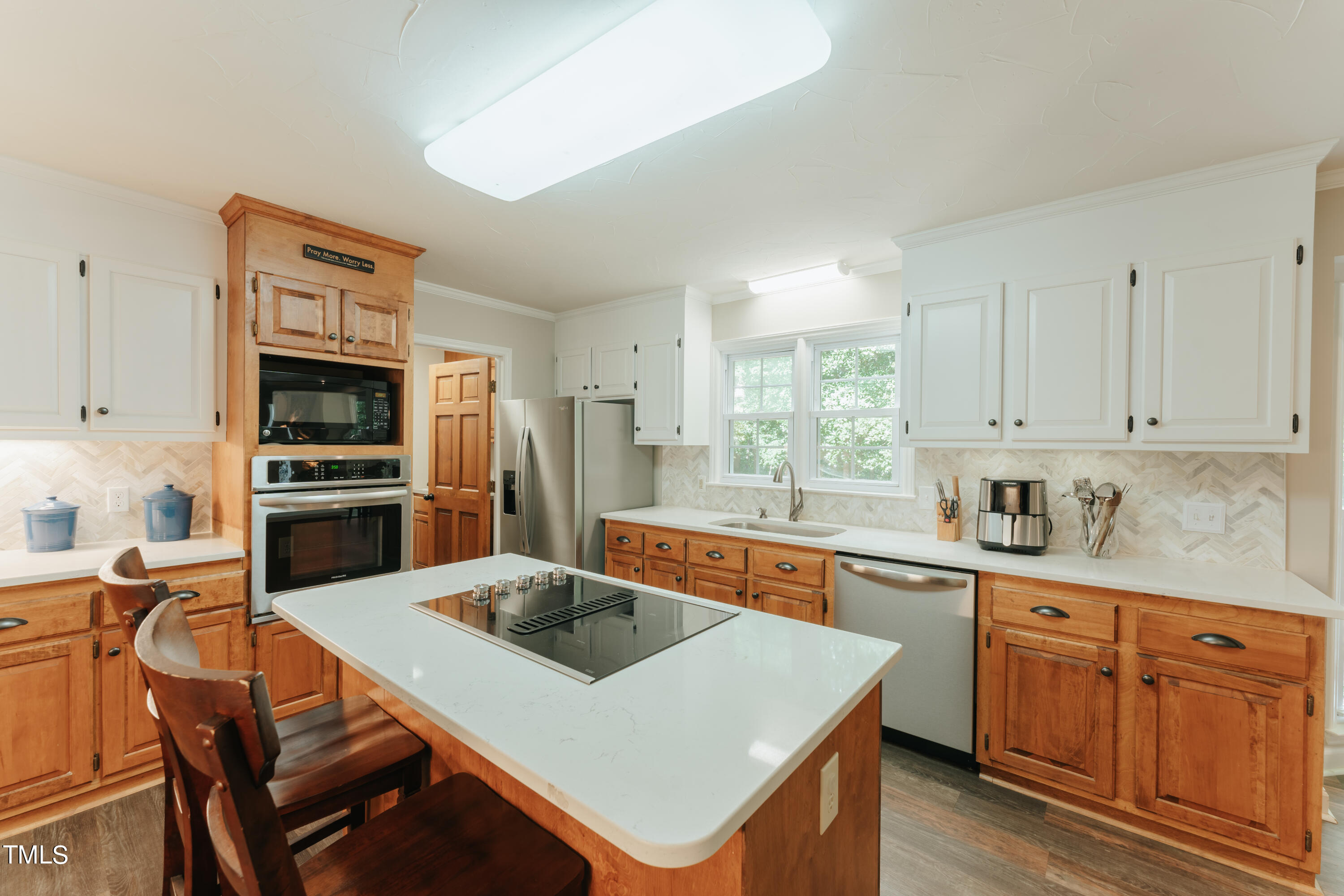 55 Sycamore Road Roxboro, NC 27574 - Photo 41 of 73 a kitchen with a stove a sink and a refrigerator