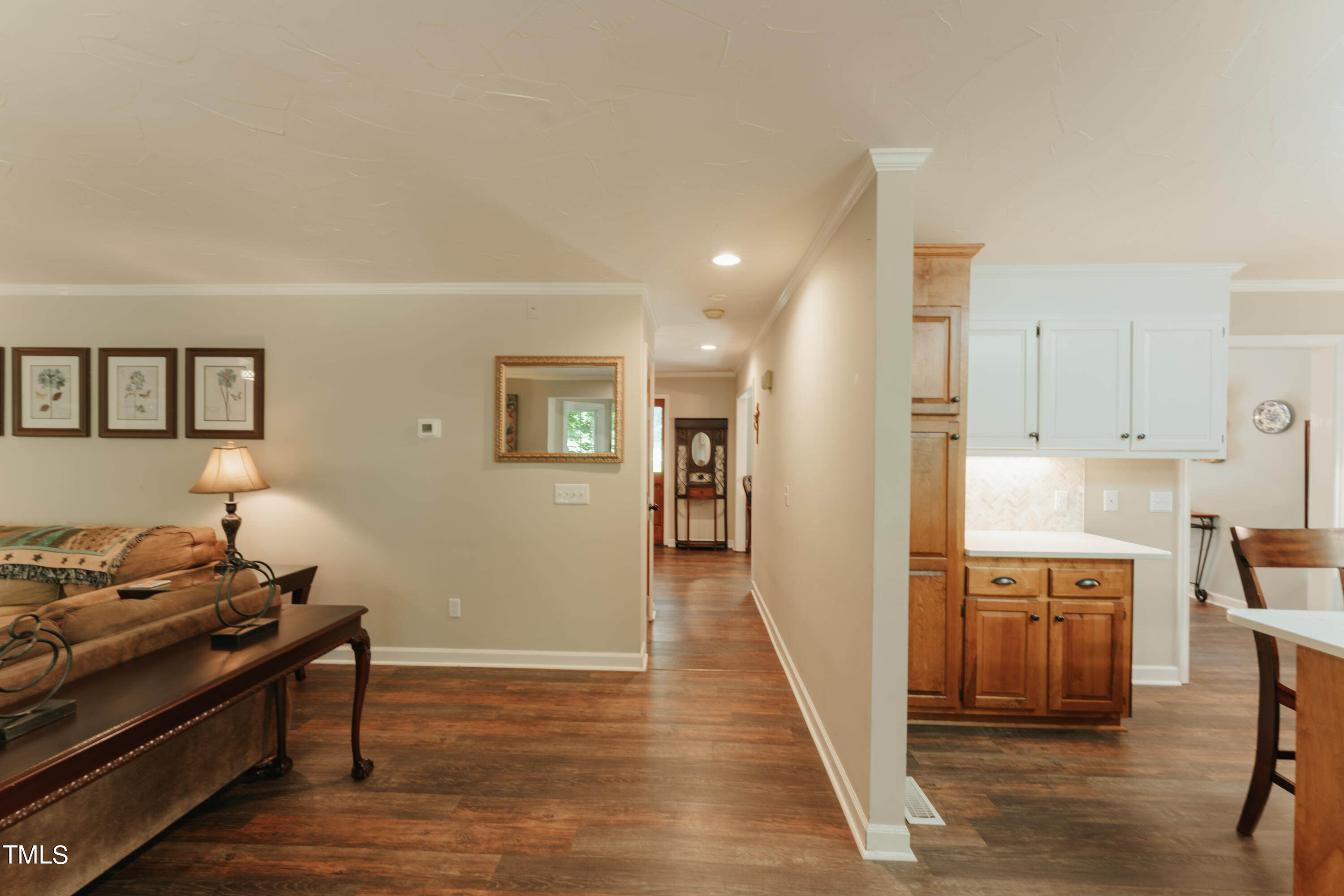 55 Sycamore Road Roxboro, NC 27574 - Photo 47 of 73 a view of a living room a dining room wooden floor and a window