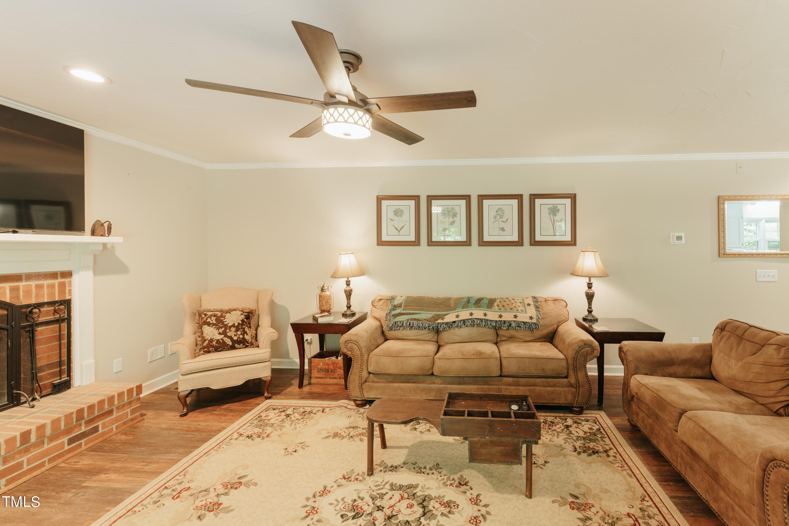 55 Sycamore Road Roxboro, NC 27574 - Photo 52 of 73 a living room with furniture and a fireplace