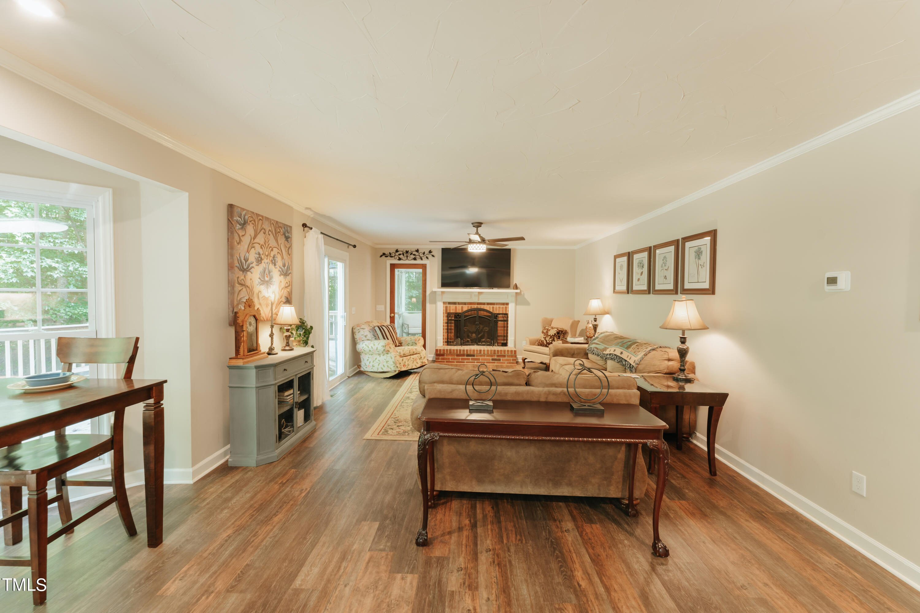 55 Sycamore Road Roxboro, NC 27574 - Photo 54 of 73 a living room with furniture and a wooden floor
