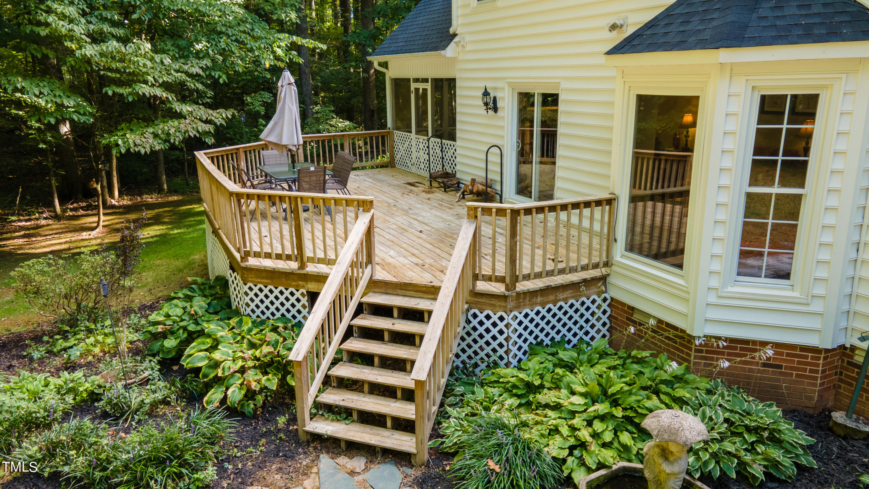55 Sycamore Road Roxboro, NC 27574 - Photo 7 of 73 a view of a chair and table on the deck