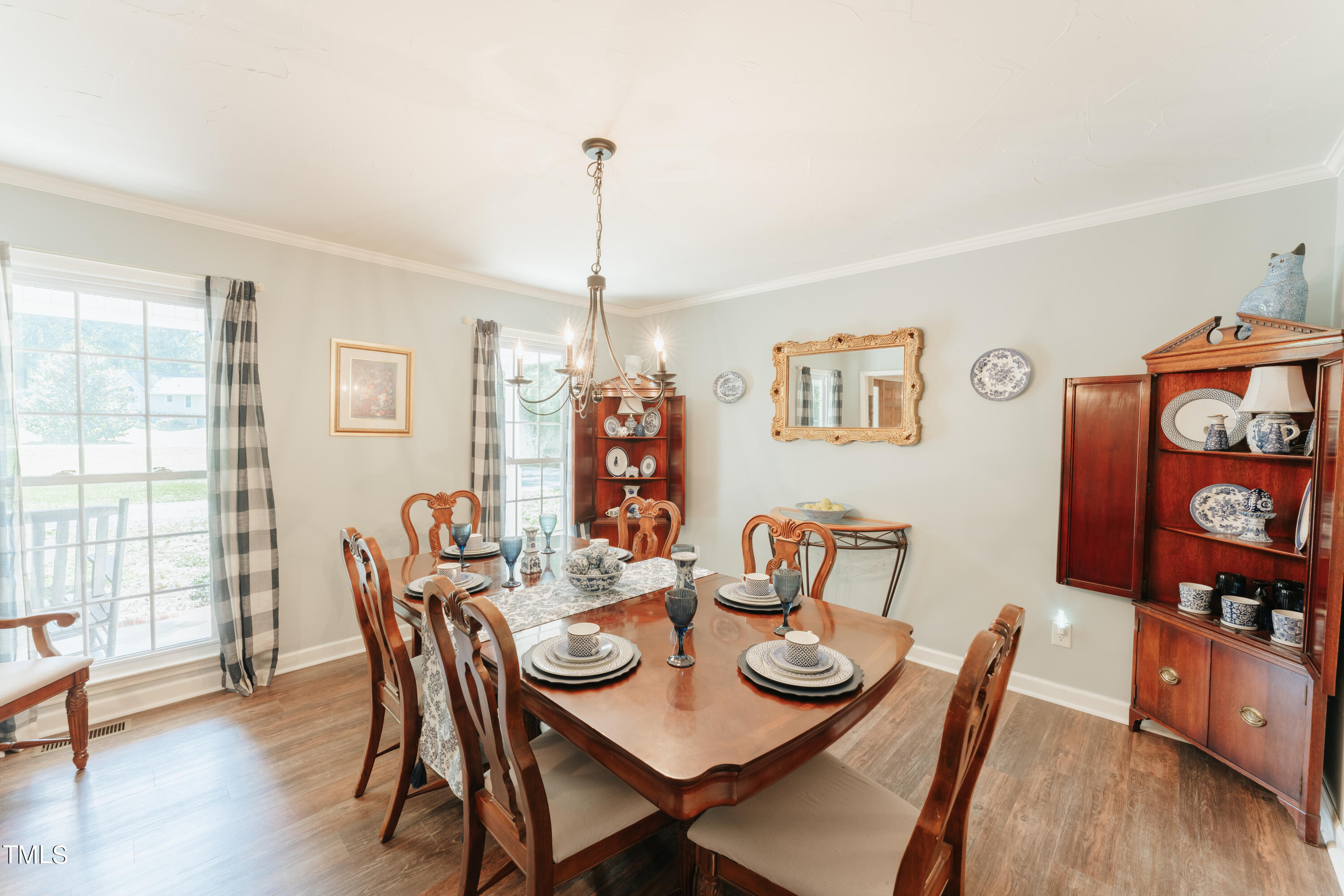 55 Sycamore Road Roxboro, NC 27574 - Photo 72 of 73 a view of a dining room with furniture window and wooden floor