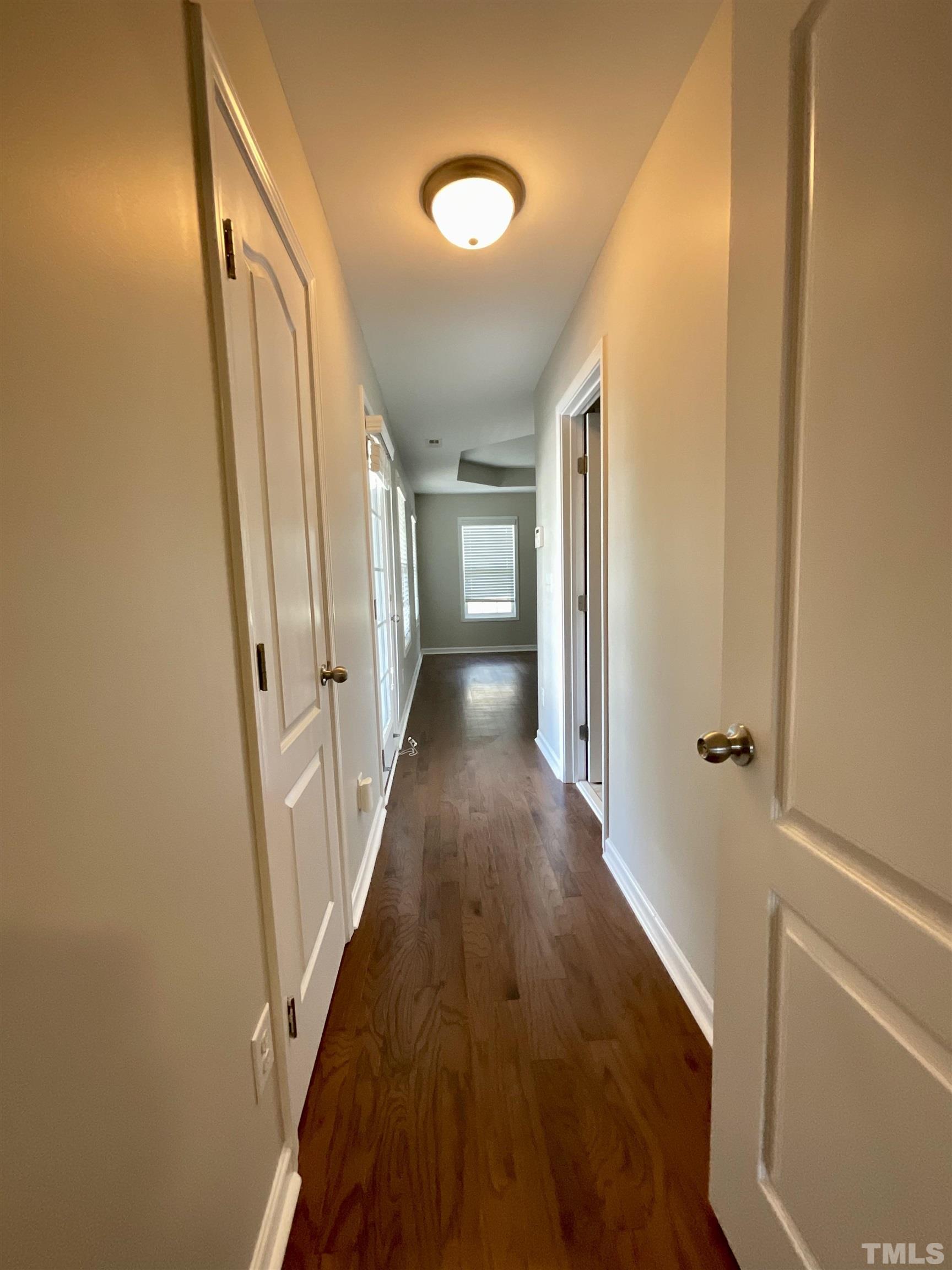2632 Cloud Mist Circle Raleigh, NC 27614 - Photo 15 of 25 a view of a hallway with wooden floor and staircase