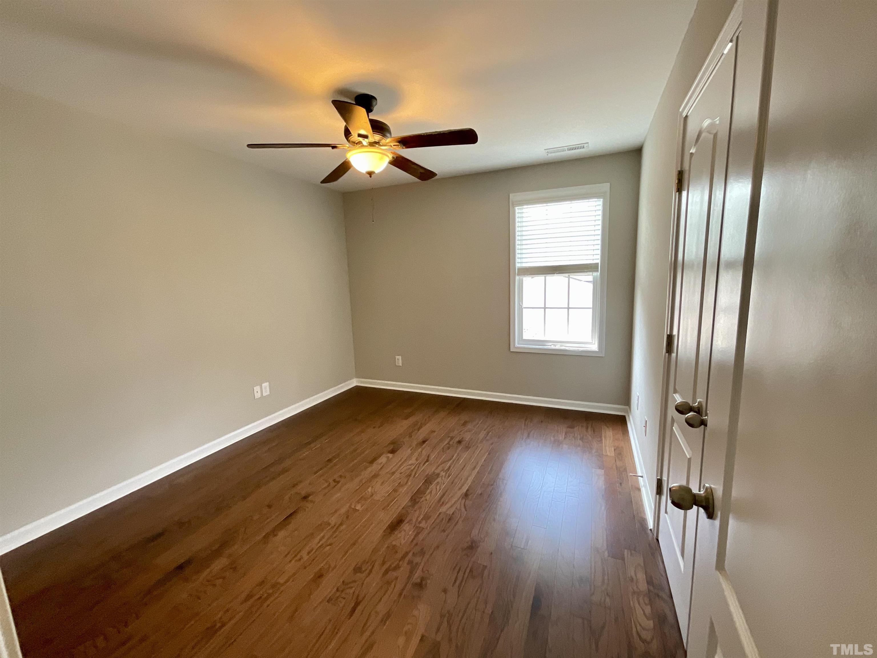 2632 Cloud Mist Circle Raleigh, NC 27614 - Photo 19 of 25 a view of empty room with wooden floor and fan