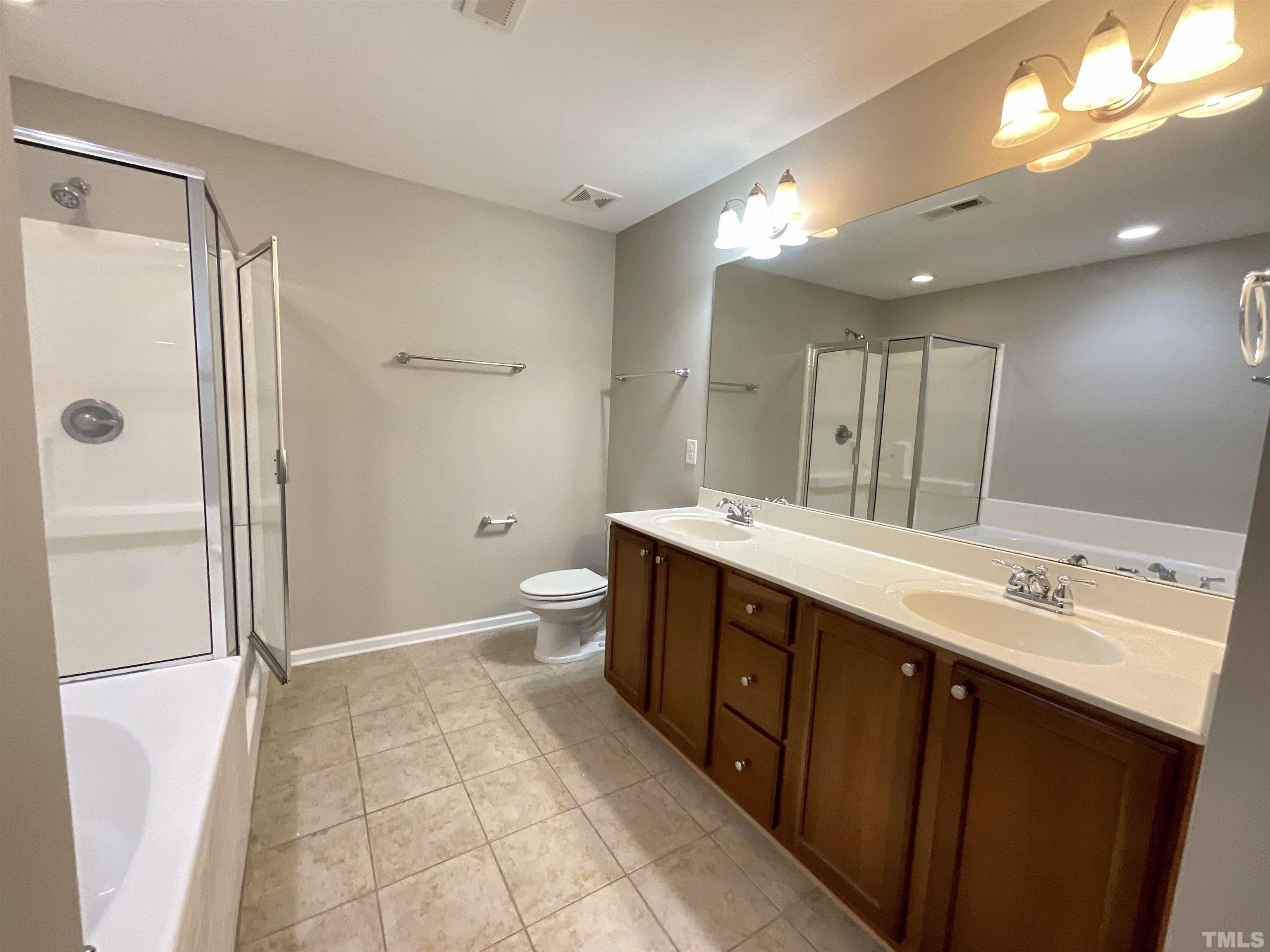 2632 Cloud Mist Circle Raleigh, NC 27614 - Photo 7 of 25 a spacious bathroom with a double vanity sink mirror double and shower
