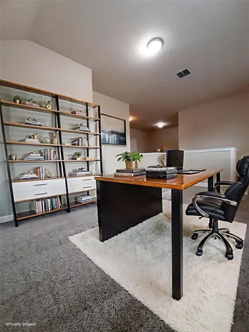 a living room with hard wood flooring and furniture