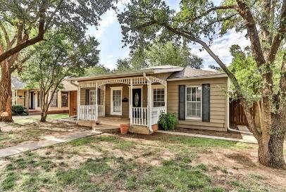 2711 22nd Street Lubbock, TX 79410 - Photo 2 of 28 a front view of a house with a garden