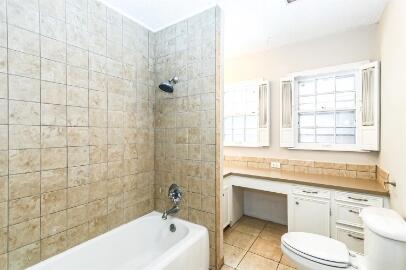 2711 22nd Street Lubbock, TX 79410 - Photo 22 of 28 a bathroom with a sink a toilet and bathtub