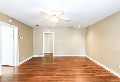 2711 22nd Street Lubbock, TX 79410 - Photo 8 of 28 a view of an empty room with wooden floor
