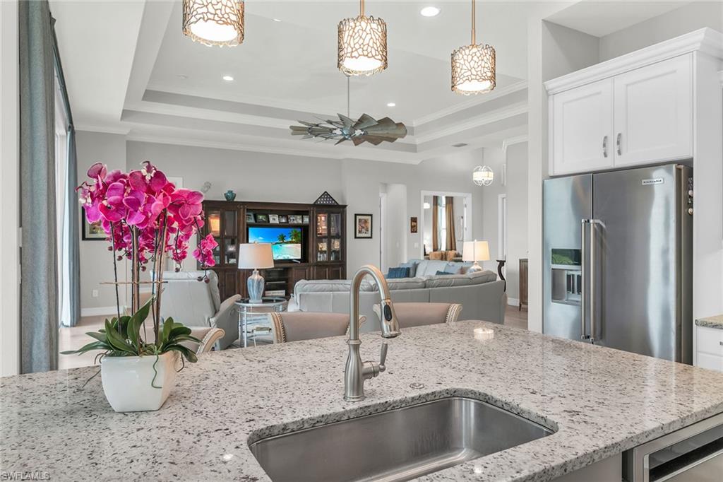 14812 Dockside Lane Naples, FL 34114 - Photo 13 of 49 a view of a living room and kitchen