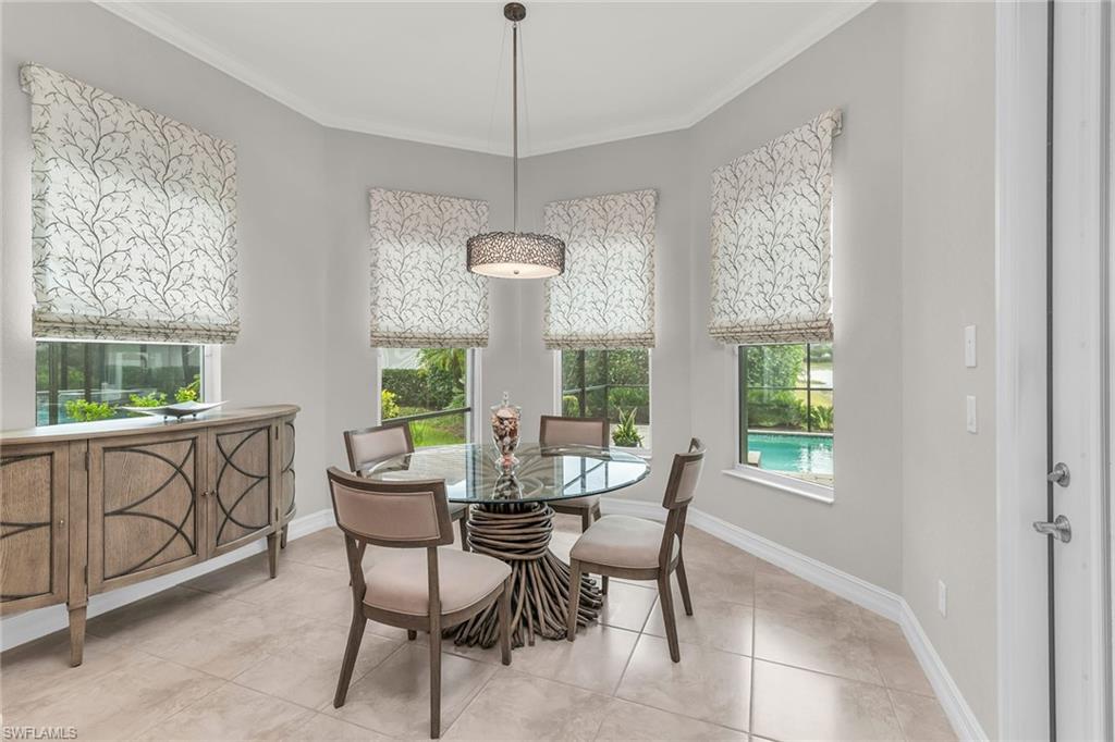 14812 Dockside Lane Naples, FL 34114 - Photo 15 of 49 a view of a dining room with furniture window and outside view