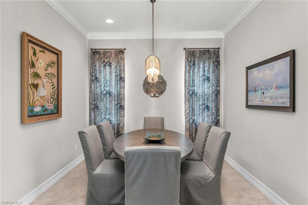 14812 Dockside Lane Naples, FL 34114 - Photo 16 of 49 a dining room with furniture and window
