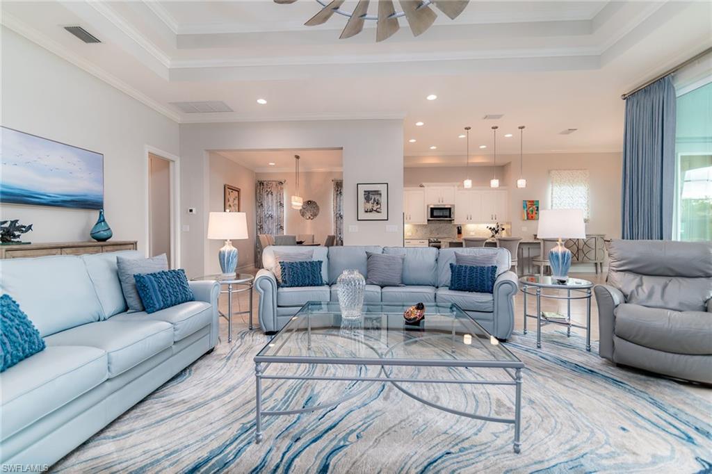14812 Dockside Lane Naples, FL 34114 - Photo 2 of 49 a living room with furniture and a large window